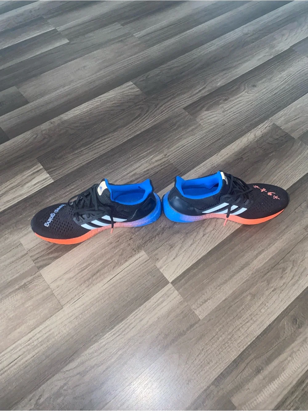 adidas Ultraboost men/women KEEP GOING Black Sneakers Blue and Orange Accents